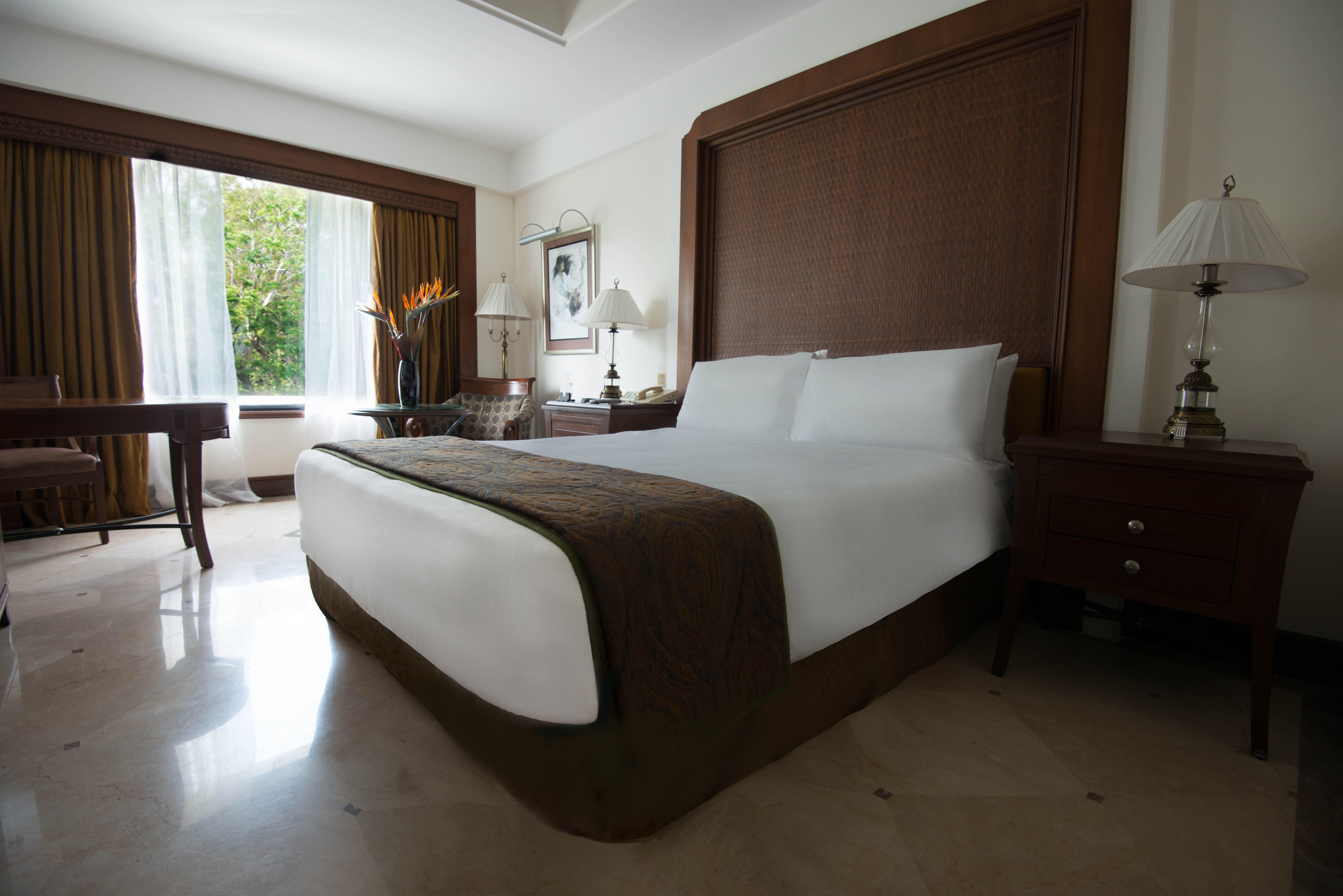 คราวน์ พลาซา เจนไน อัทยาร์ พาร์ค Hotel เชนไน ภายนอก รูปภาพ A bedroom at the Taj Bengal